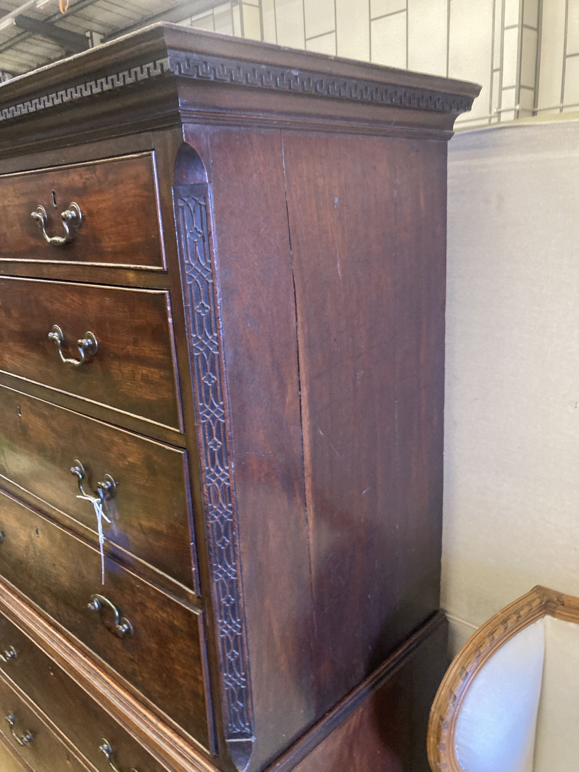 A George III mahogany chest on chest, two short and three long graduated drawers, the base with three graduated cockbeaded drawers, on